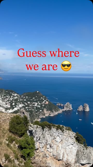 Aerial view of the Capri coastline and Faraglioni rock formations along the Italian coast